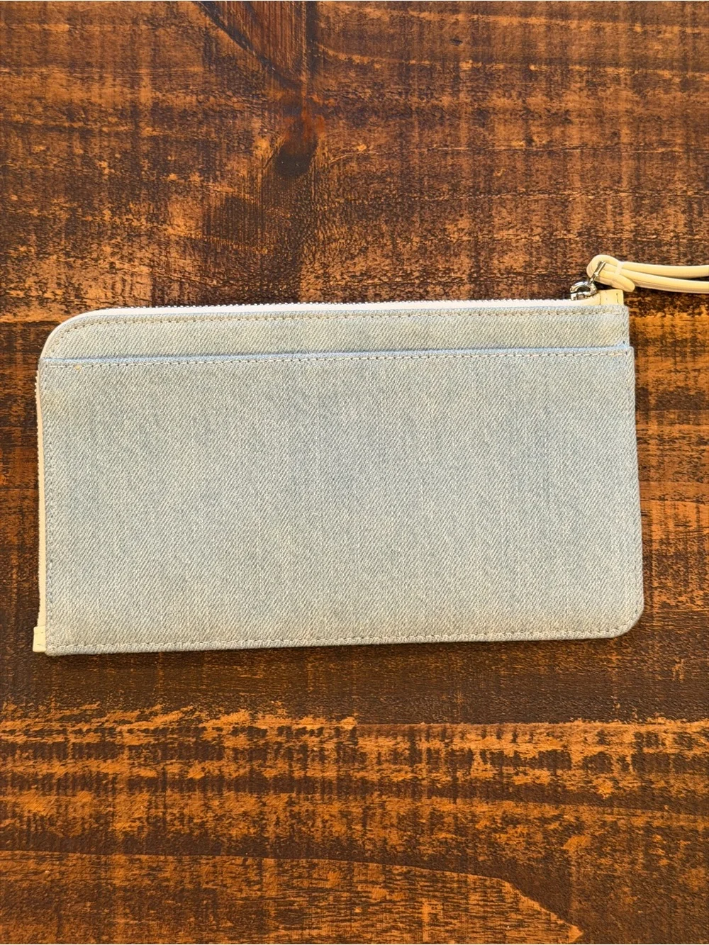 kate spade light denim wristlet with cream strap